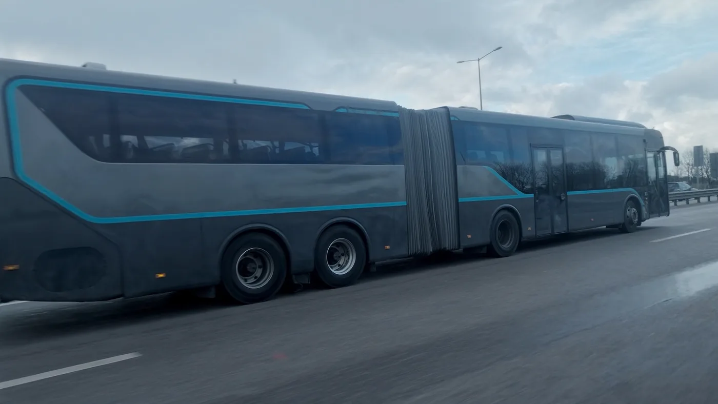 Articulated electric bus driving through a European city